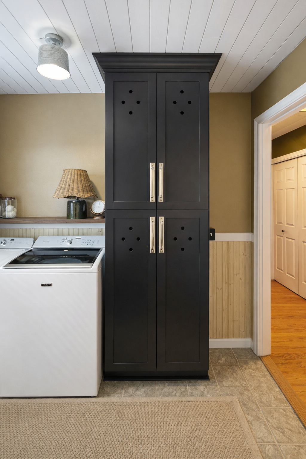 Finished black laundry storage cabinet